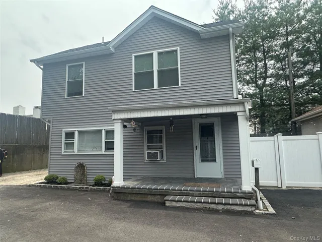 a white house with a outdoor space