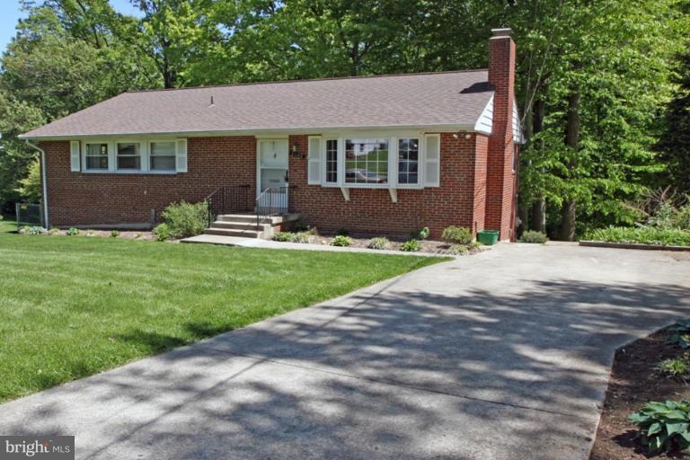 5648 Inverchapel Road Springfield, VA 22151 - Photo 1 of 30 a front view of a house with yard and green space