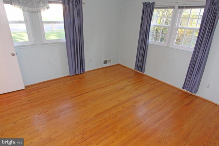 5648 Inverchapel Road Springfield, VA 22151 - Photo 20 of 30 a big room with wooden floor and windows