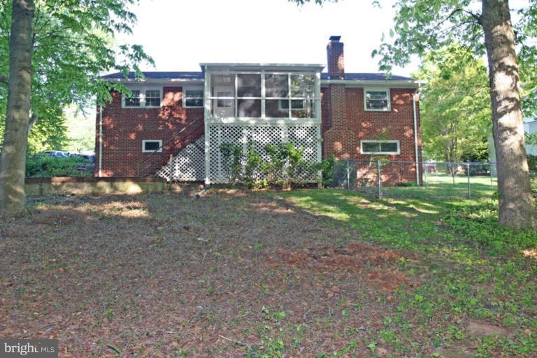 5648 Inverchapel Road Springfield, VA 22151 - Photo 3 of 30 a view of a house with a yard and a tree