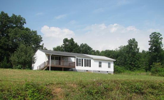 1191 Bethany Road Callaway, VA 24067 - Photo 1 of 13 a front view of house with yard and trees around