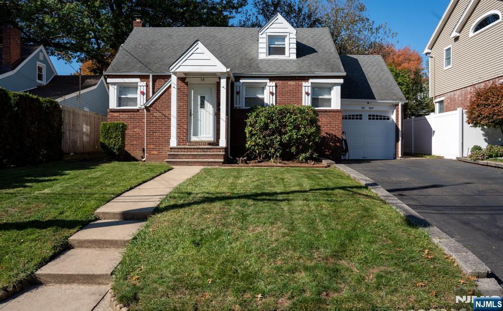 58 Elm Street Dumont, NJ 07628 - Photo 1 of 28 front view of house with a yard