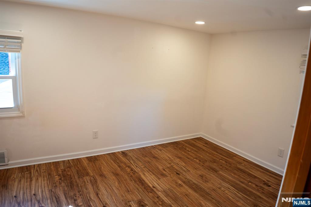 58 Elm Street Dumont, NJ 07628 - Photo 17 of 28 a view of room with wooden floor and fan