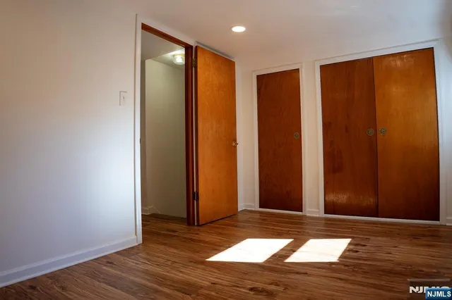 a view of a livingroom with wooden floor