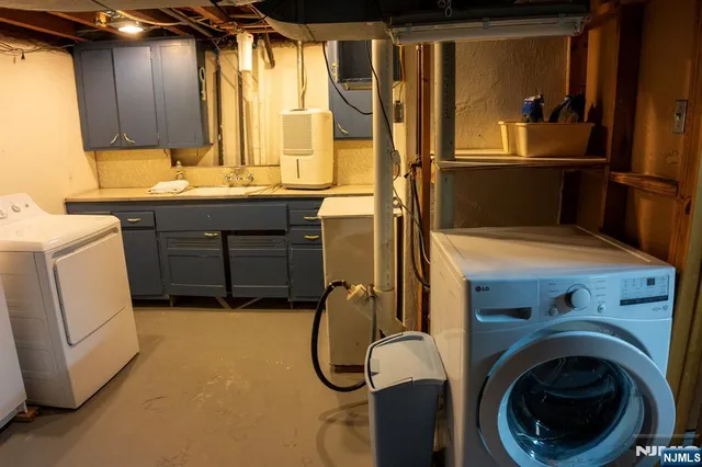 a utility room with closet dryer and washer
