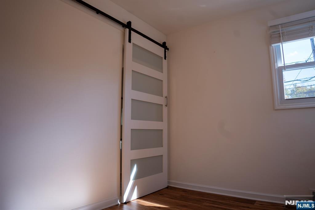 58 Elm Street Dumont, NJ 07628 - Photo 5 of 28 a view of walk in closet with empty racks