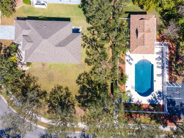 an aerial view of a house with swimming pool