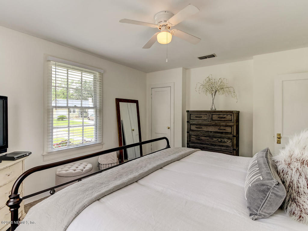 4603 Birkenhead Road Jacksonville, FL 32210 - Photo 25 of 43 a bedroom with a bed dresser and a window