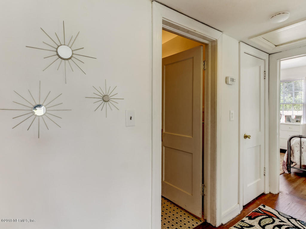4603 Birkenhead Road Jacksonville, FL 32210 - Photo 27 of 43 a view of a hallway with closet and a chandelier fan