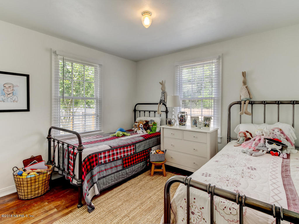 4603 Birkenhead Road Jacksonville, FL 32210 - Photo 28 of 43 a bedroom with a bed and window