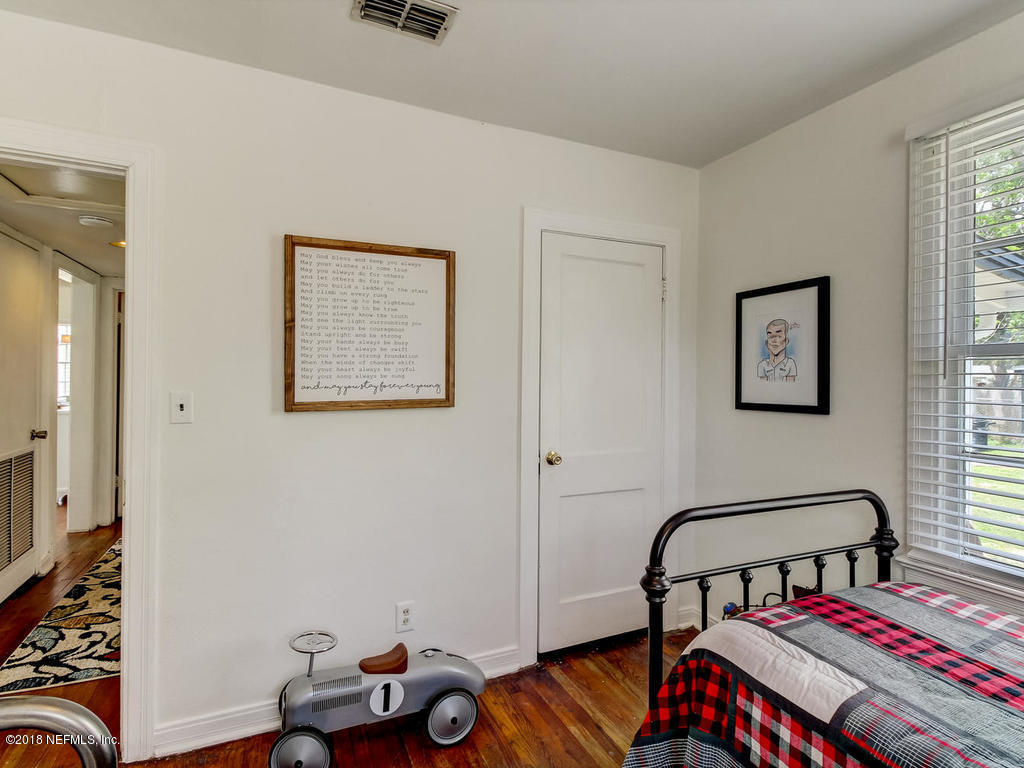 4603 Birkenhead Road Jacksonville, FL 32210 - Photo 29 of 43 a bedroom with furniture and a window