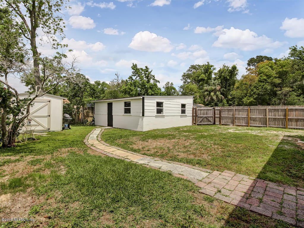 4603 Birkenhead Road Jacksonville, FL 32210 - Photo 34 of 43 a view of a backyard with a garden