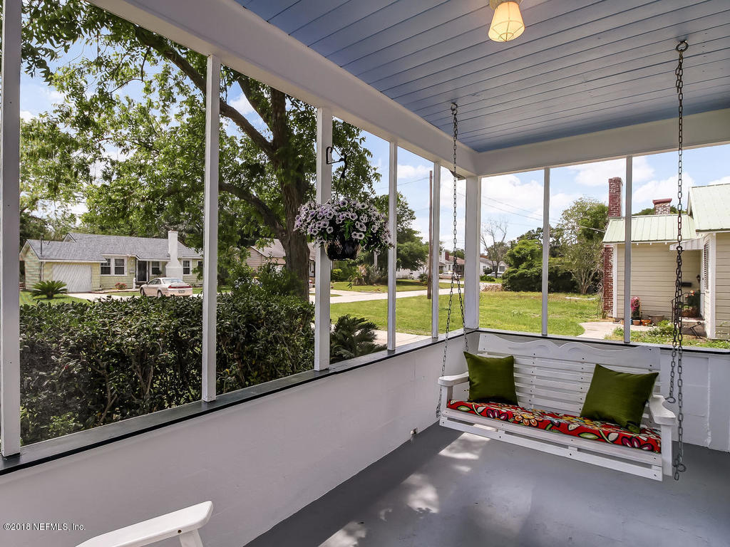 4603 Birkenhead Road Jacksonville, FL 32210 - Photo 5 of 43 a view of a chairs and table in patio with a yard