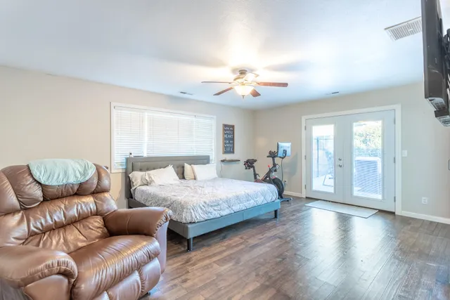 a spacious bedroom with a bed and furniture