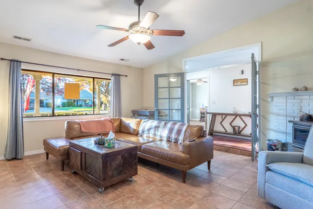 a living room with furniture and a large window