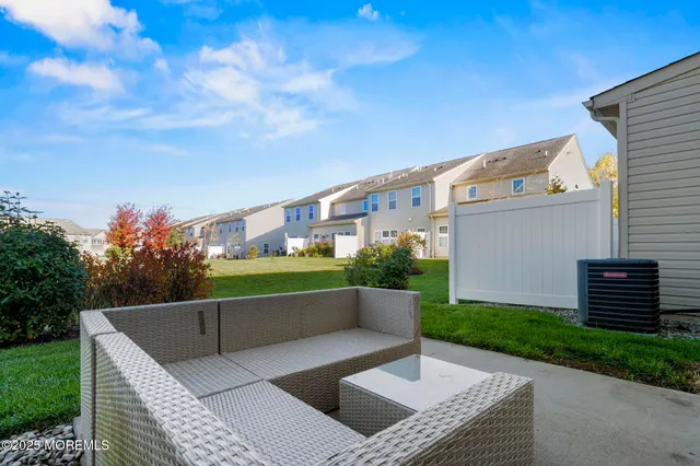 a kitchen with stainless steel appliances kitchen island granite countertop a refrigerator stove and sink