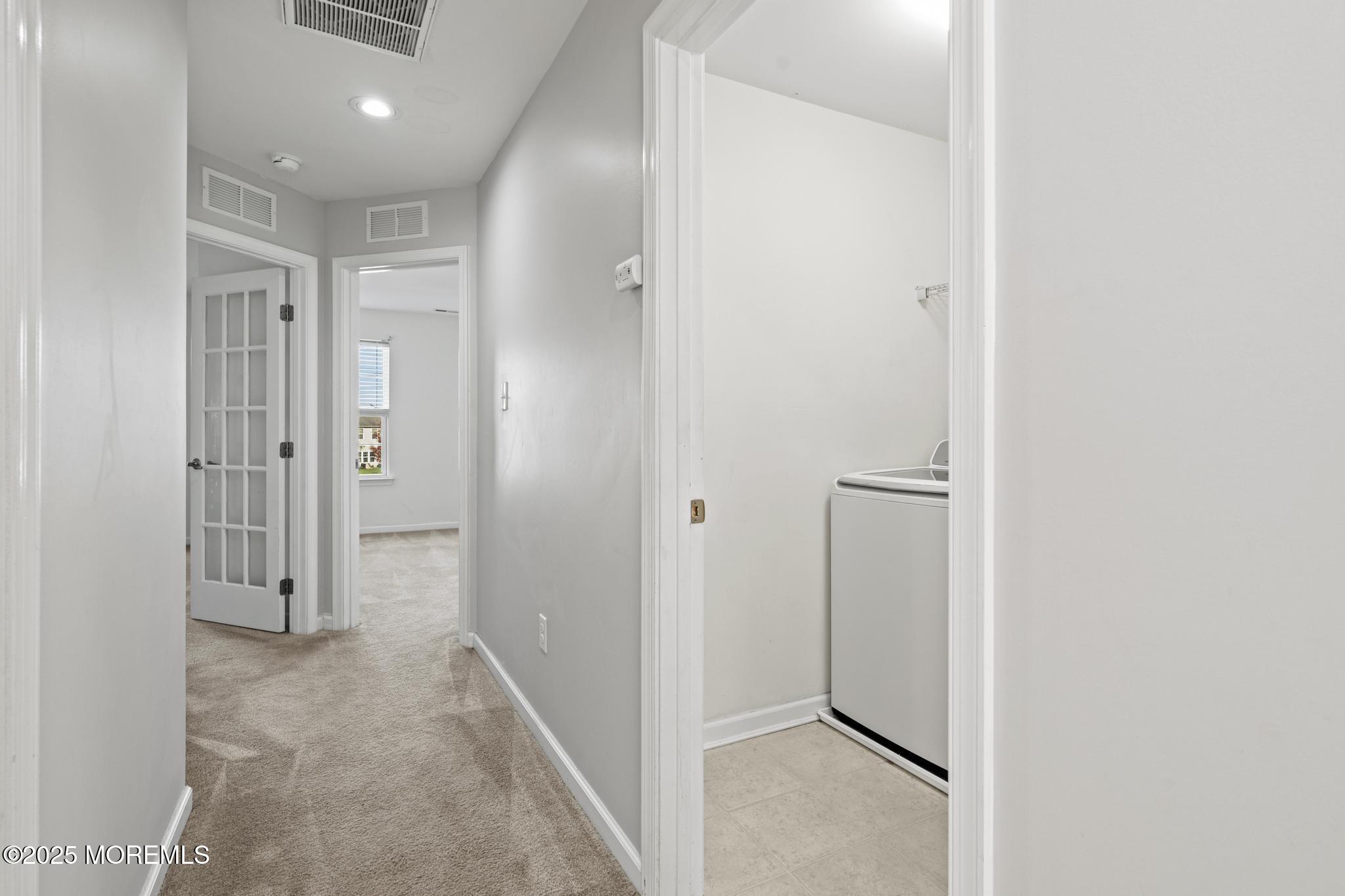 125 Sundance Drive Hamilton, NJ 08619 - Photo 18 of 31 a view of a hallway with closet and a bathroom