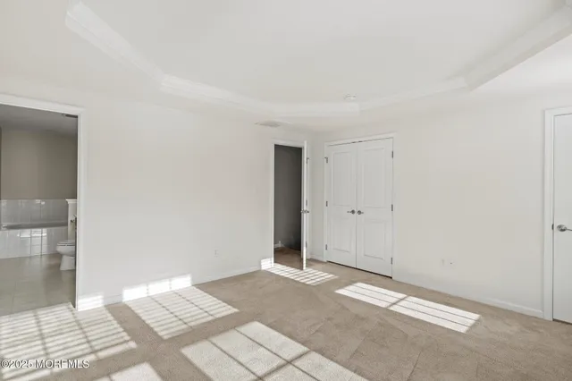 a bathroom with a sink vanity granite toilet and a mirror