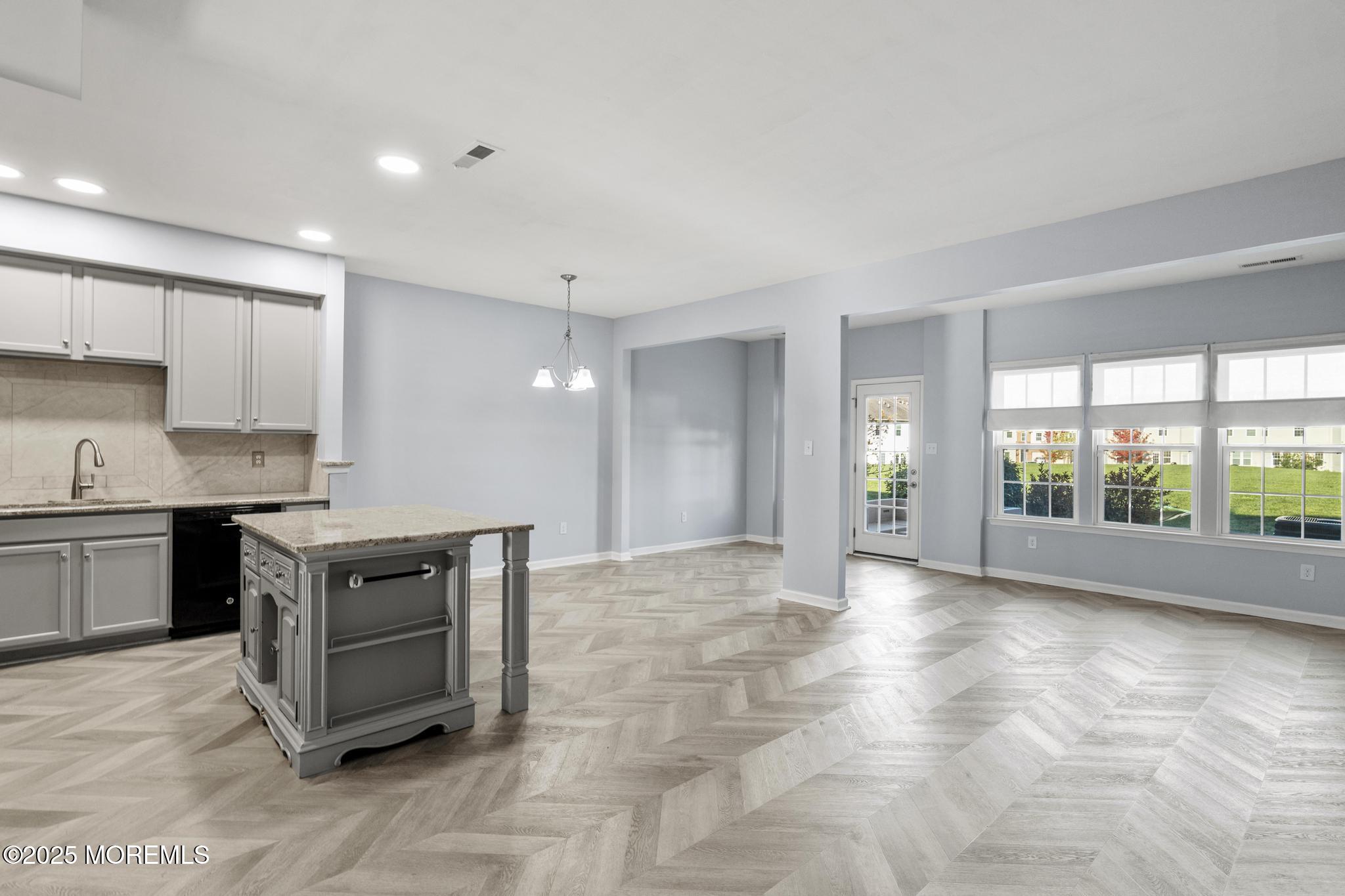 125 Sundance Drive Hamilton, NJ 08619 - Photo 4 of 31 a kitchen with stainless steel appliances granite countertop a stove a sink and a refrigerator