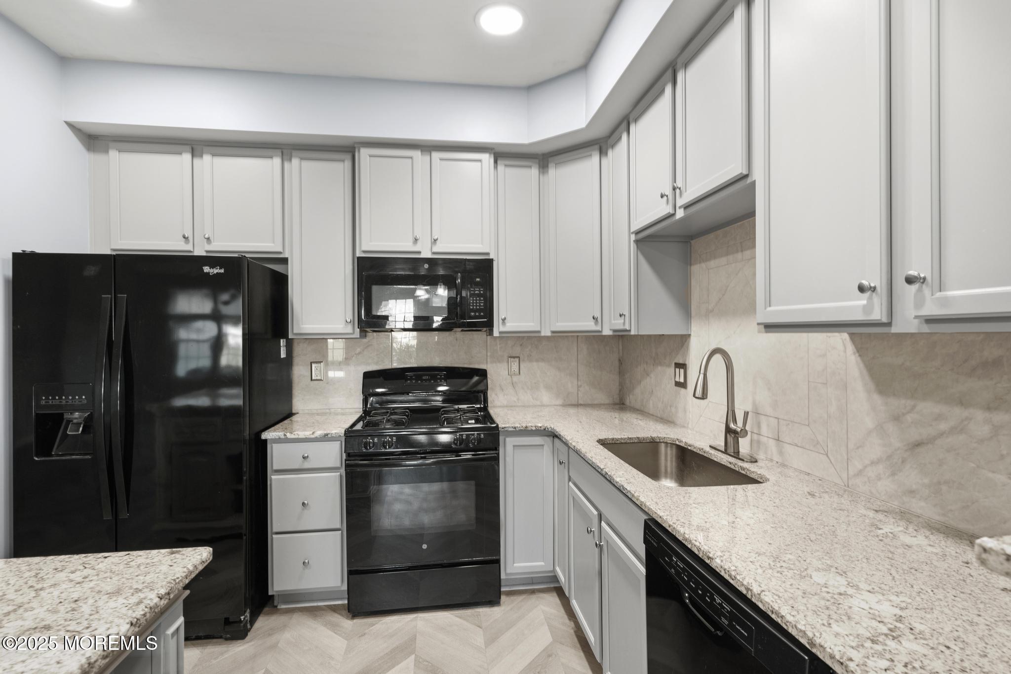 125 Sundance Drive Hamilton, NJ 08619 - Photo 8 of 31 a kitchen with a sink stove and refrigerator