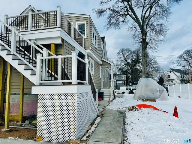 a front view of a house with a garage
