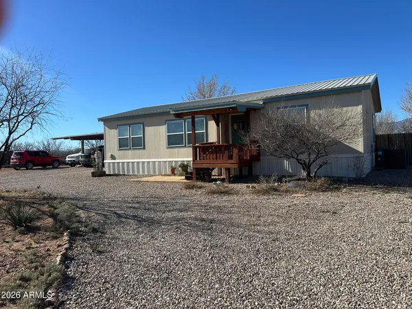 a house view with a backyard space