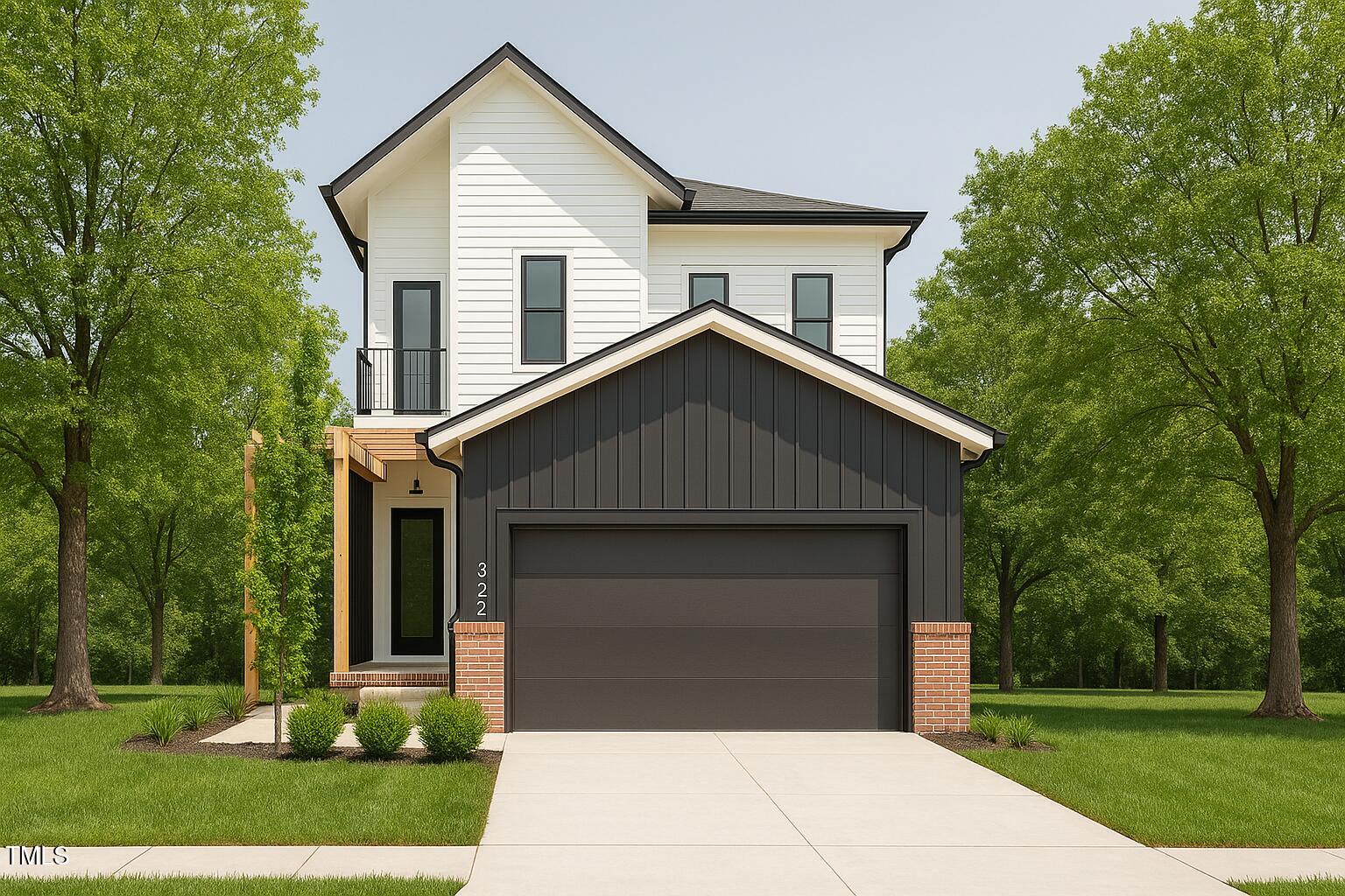 a front view of a house with a yard and trees