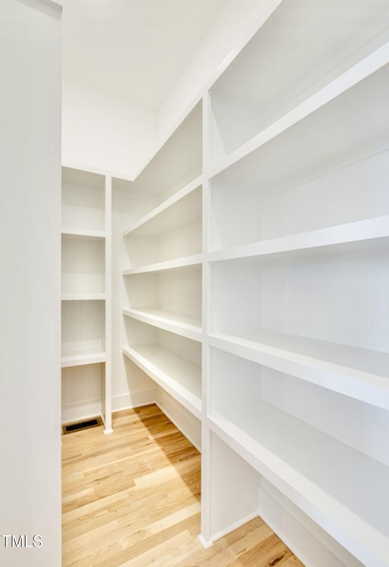 322 South Dixon Avenue, Unit R Cary, NC 27511 - Photo 15 of 37 a view of a room with empty racks