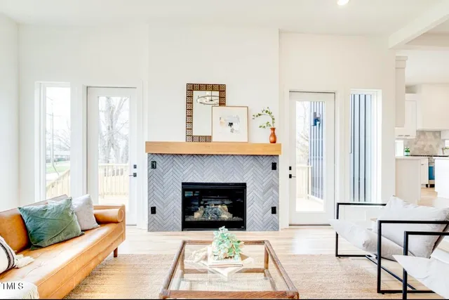 a living room with furniture and a fireplace