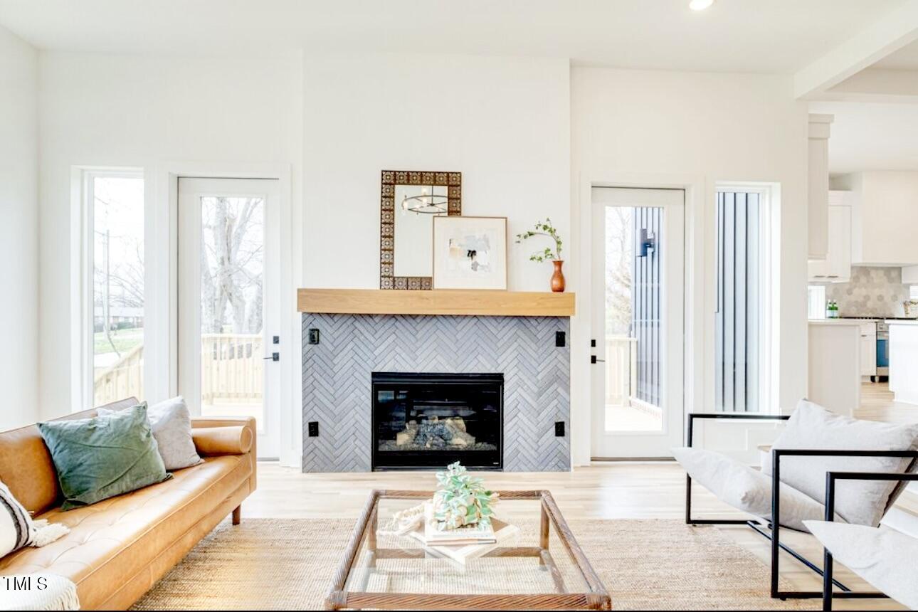 322 South Dixon Avenue, Unit R Cary, NC 27511 - Photo 19 of 37 a living room with furniture and a fireplace