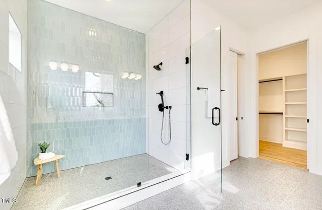 a bathroom with a shower and a toilet