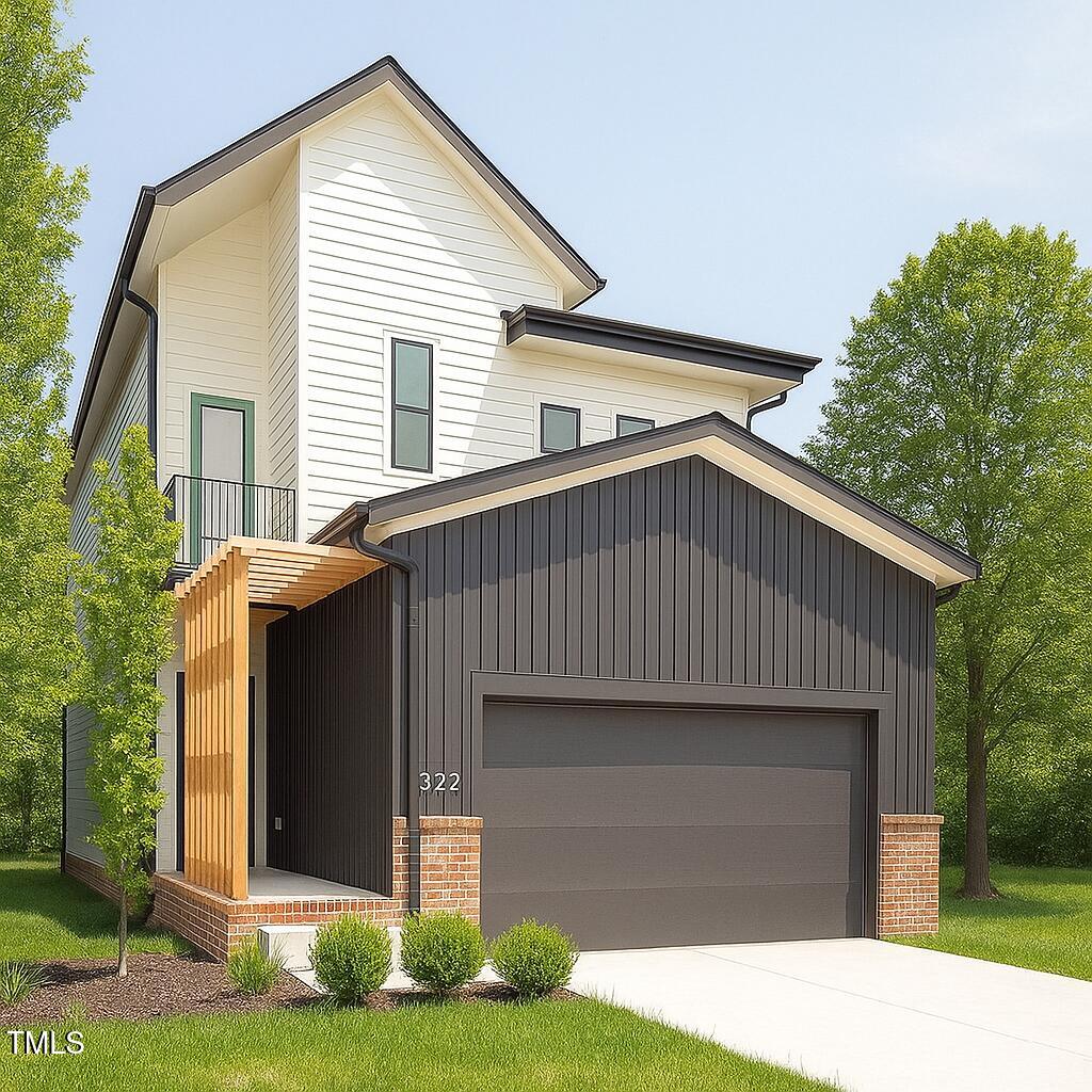 322 South Dixon Avenue, Unit R Cary, NC 27511 - Photo 3 of 37 a front view of a house with garden