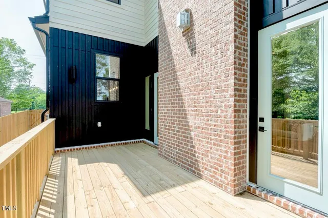a balcony view with a glass door