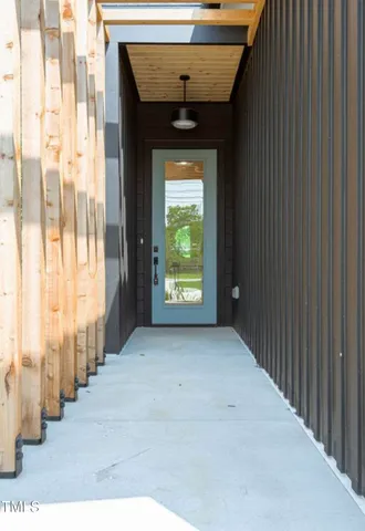 a view of entryway with wooden floor