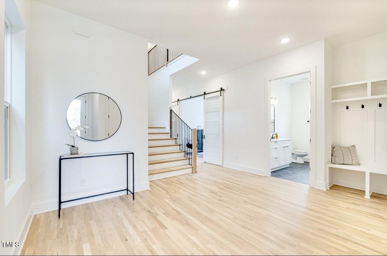 322 South Dixon Avenue, Unit R Cary, NC 27511 - Photo 7 of 37 a view of a room with wooden floor and a bathroom