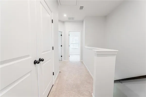 a view of storage and utility room with racks on the wall