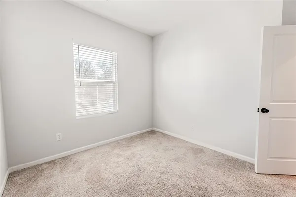 wooden floor with white walls