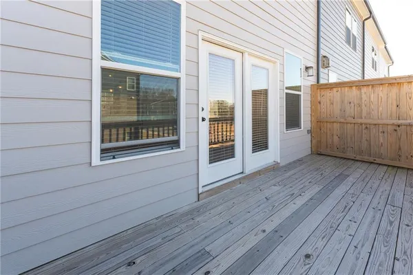 a view of a balcony with wooden floor
