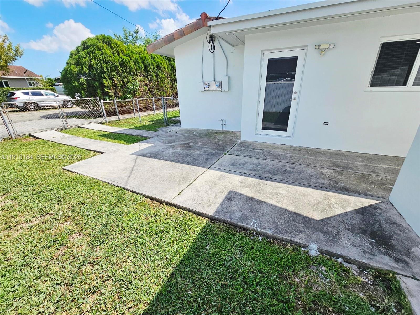 9301 Southwest 37th Street, Unit 4 Miami, FL 33165 - Photo 2 of 10 a view of a backyard of the house