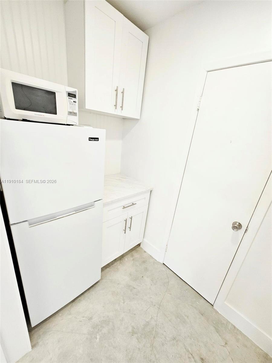 9301 Southwest 37th Street, Unit 4 Miami, FL 33165 - Photo 7 of 10 a utility room with dryer and washer