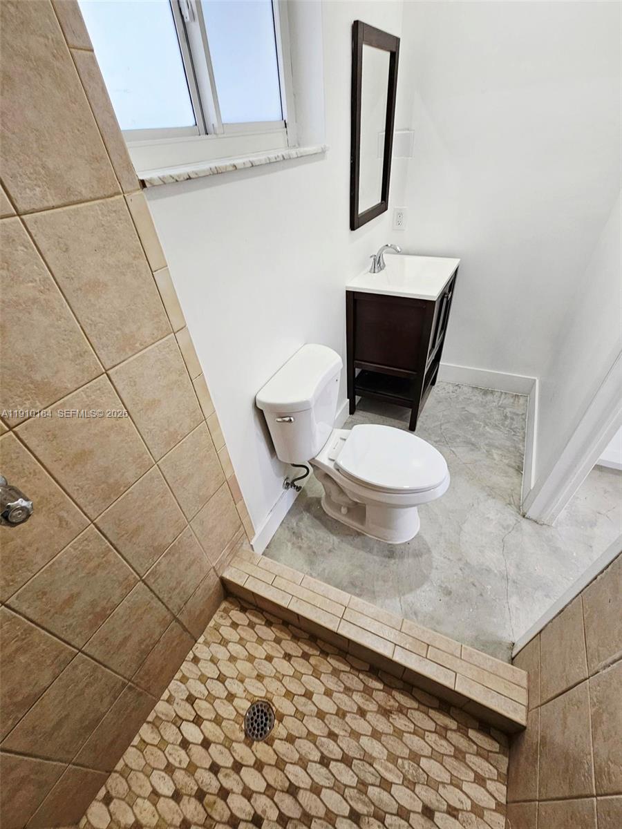 9301 Southwest 37th Street, Unit 4 Miami, FL 33165 - Photo 9 of 10 a bathroom with a toilet