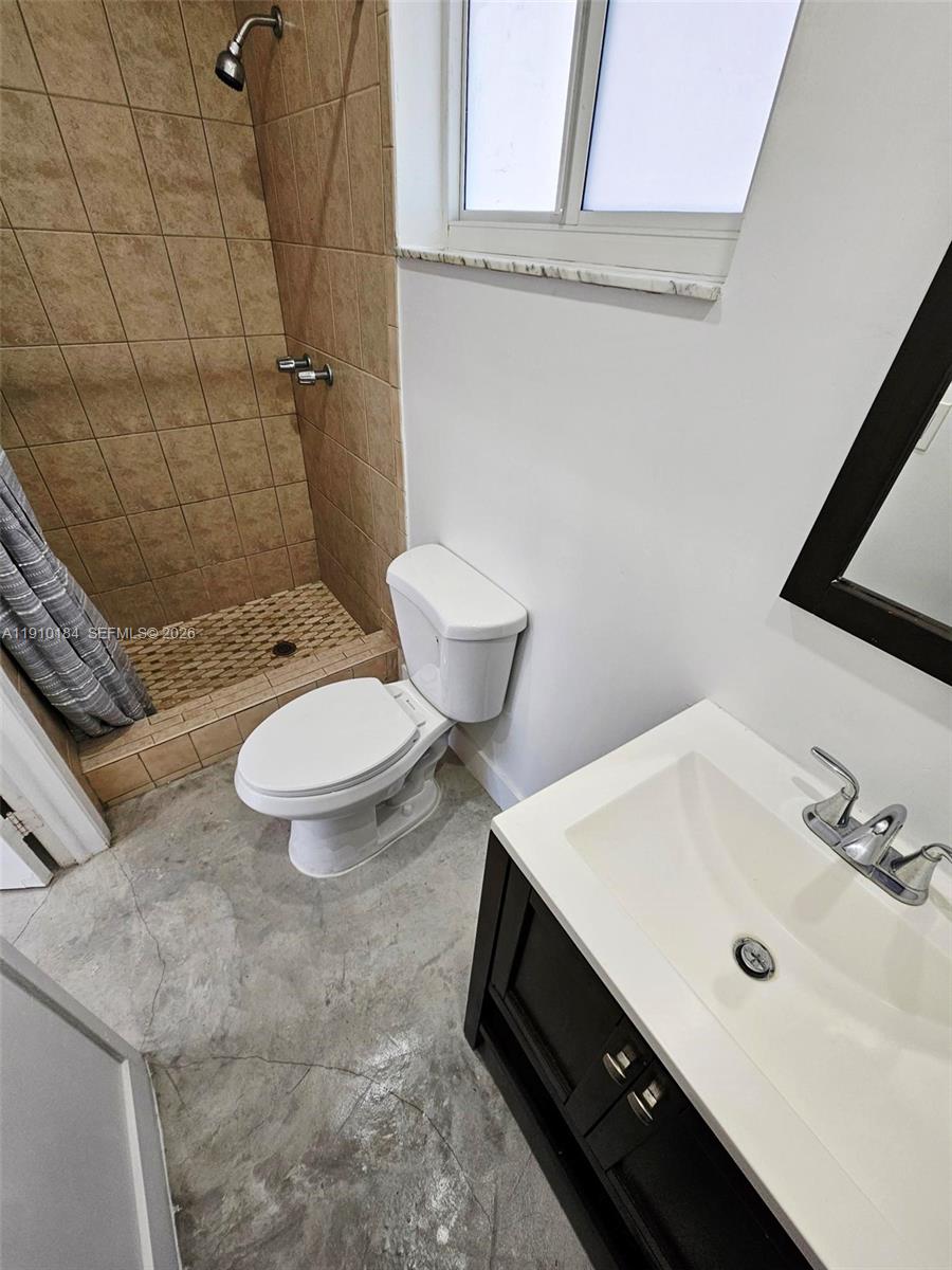 9301 Southwest 37th Street, Unit 4 Miami, FL 33165 - Photo 10 of 10 a bathroom with a sink toilet and shower