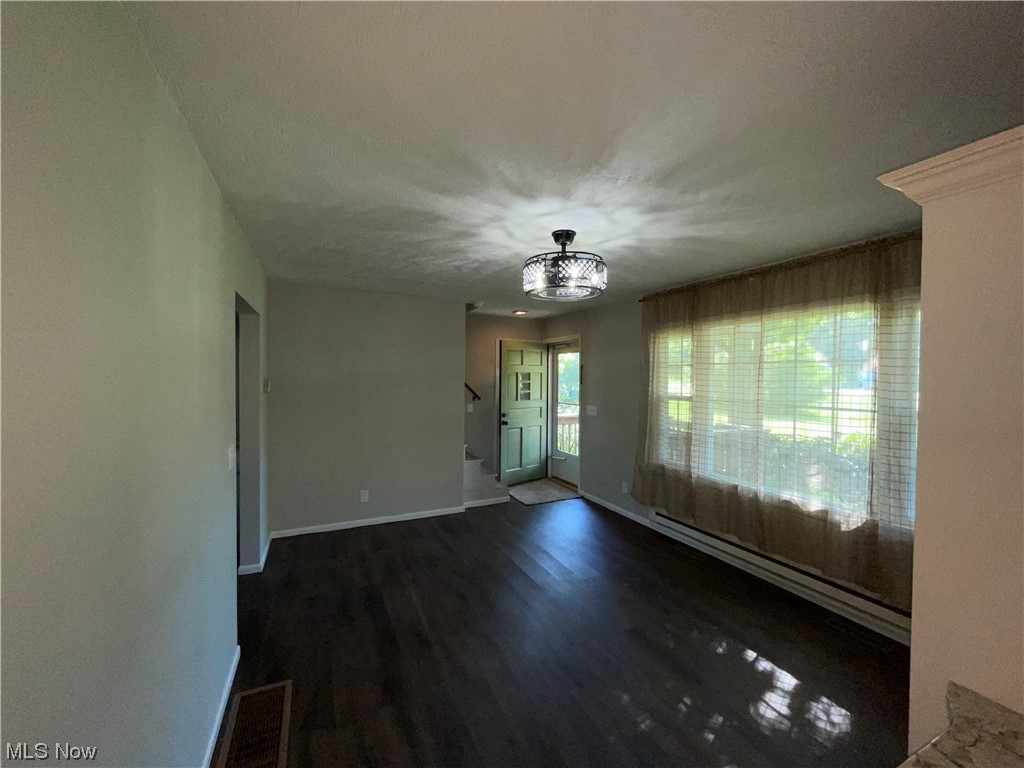 7114 Risden Road Vermilion, OH 44089 - Photo 15 of 35 Unfurnished room with dark hardwood flooring
