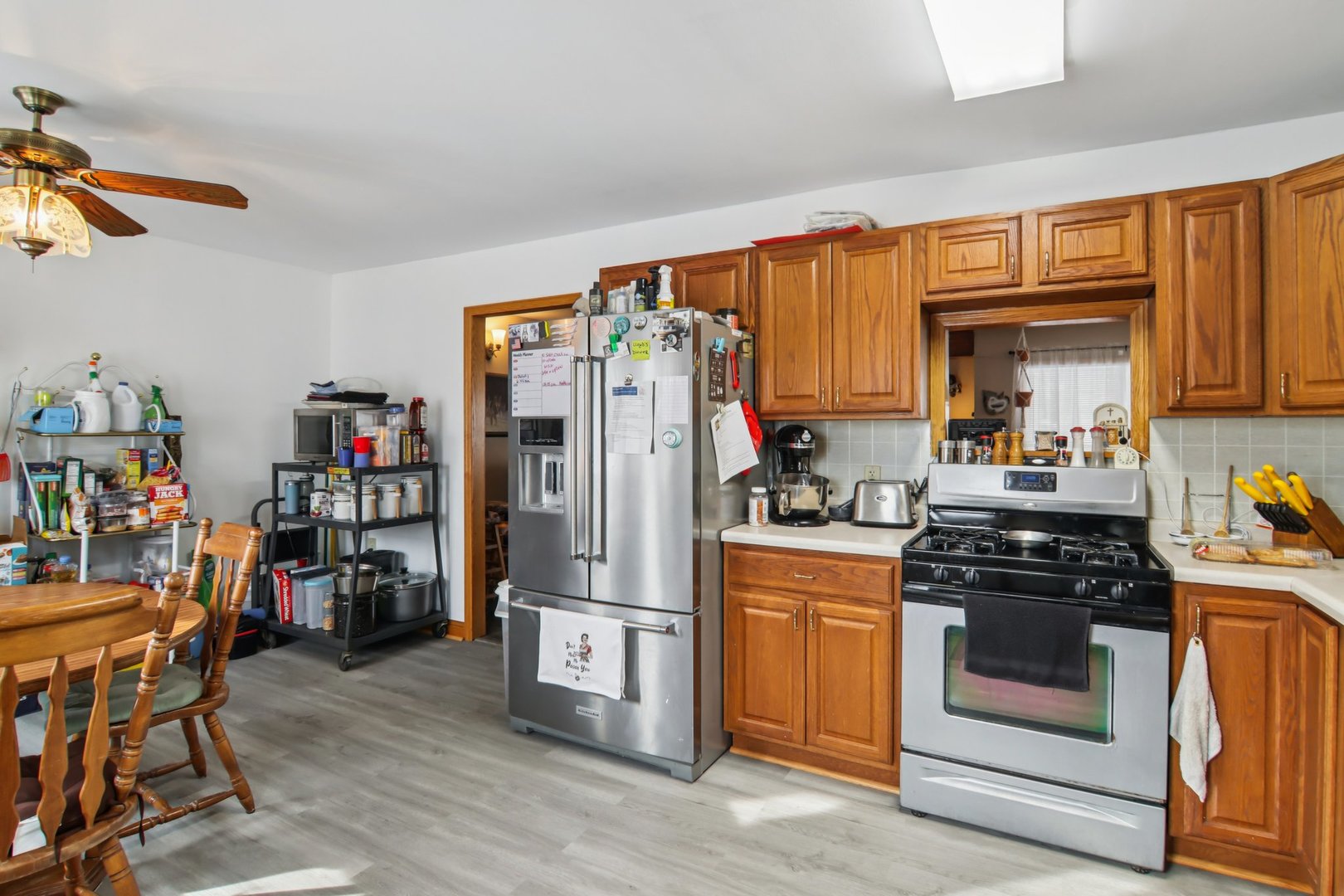 327 Hickory Avenue Romeoville, IL 60446 - Photo 17 of 33 a kitchen with stainless steel appliances a stove a refrigerator and a refrigerator