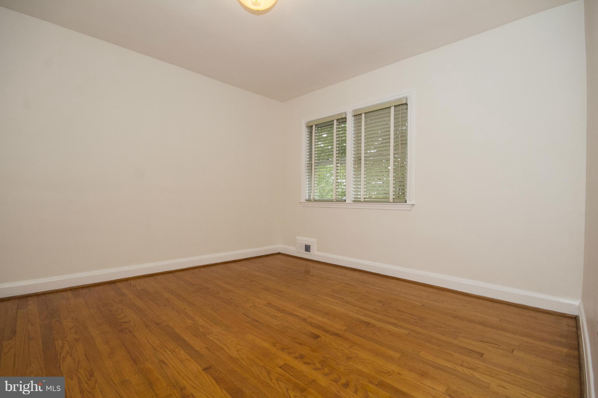 5626 Sagra Road Baltimore, MD 21239 - Photo 12 of 27 an empty room with a window