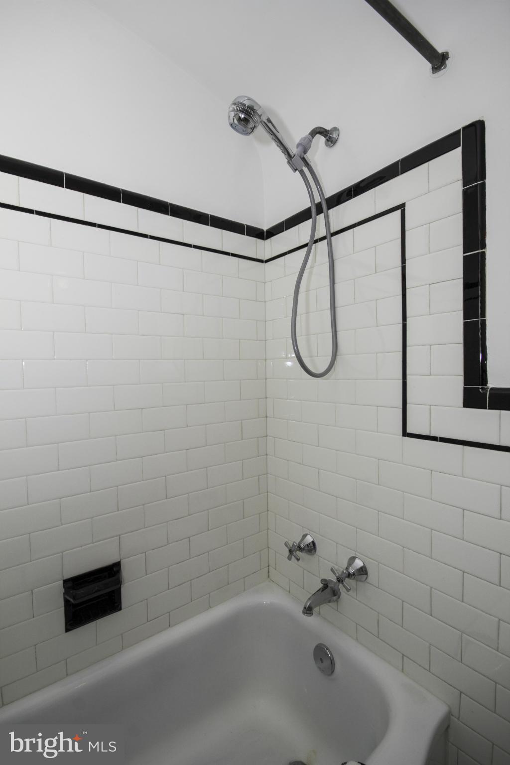 5626 Sagra Road Baltimore, MD 21239 - Photo 17 of 27 a bathroom with a shower and a shower