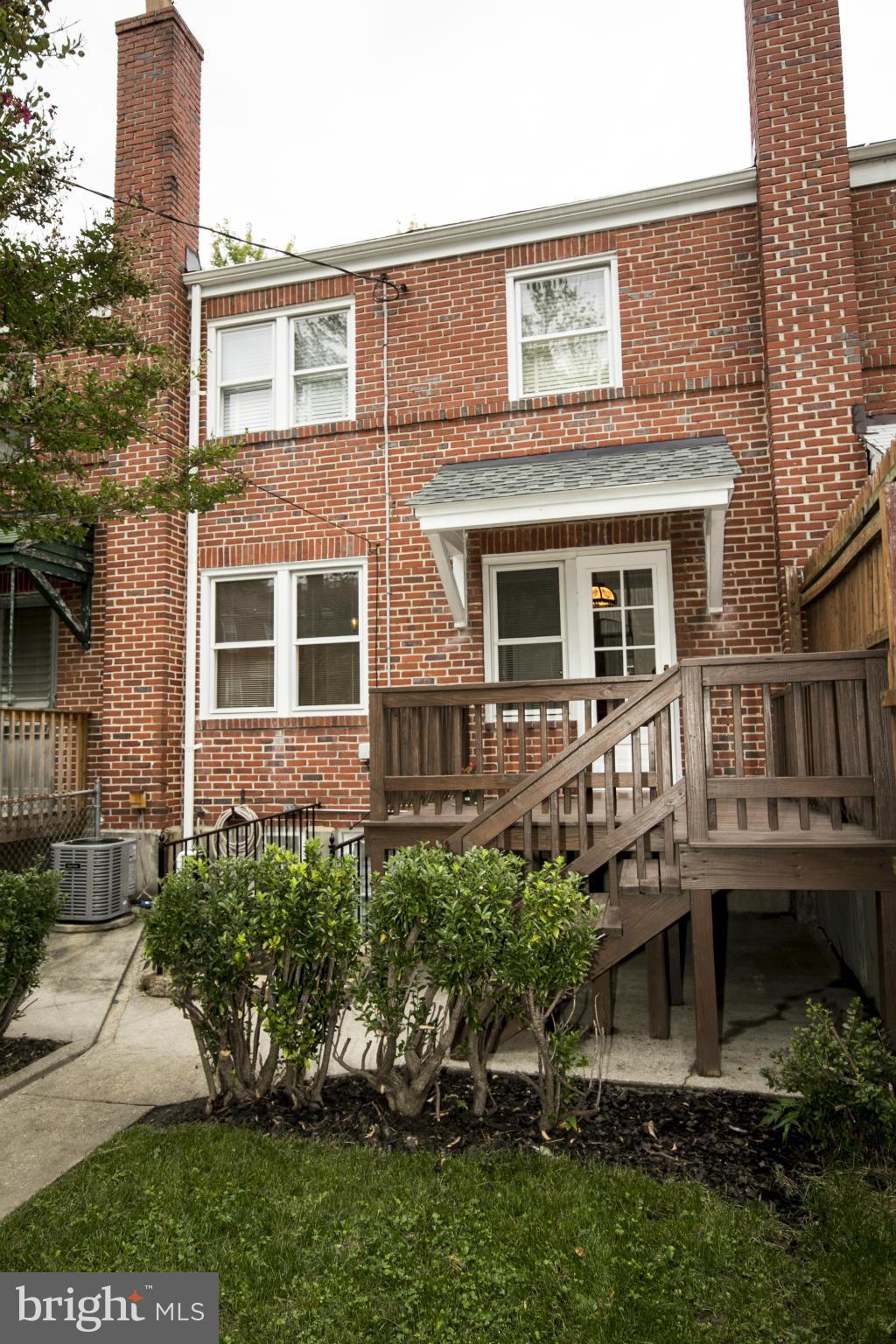 5626 Sagra Road Baltimore, MD 21239 - Photo 20 of 27 a front view of a house with balcony and trees