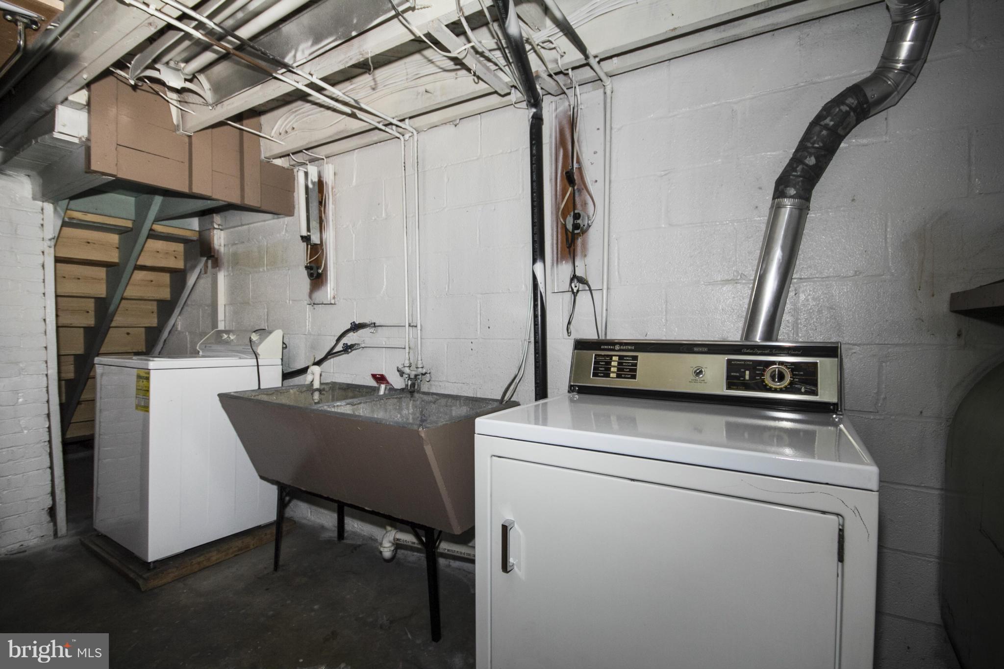 5626 Sagra Road Baltimore, MD 21239 - Photo 23 of 27 a utility room with dryer and washer