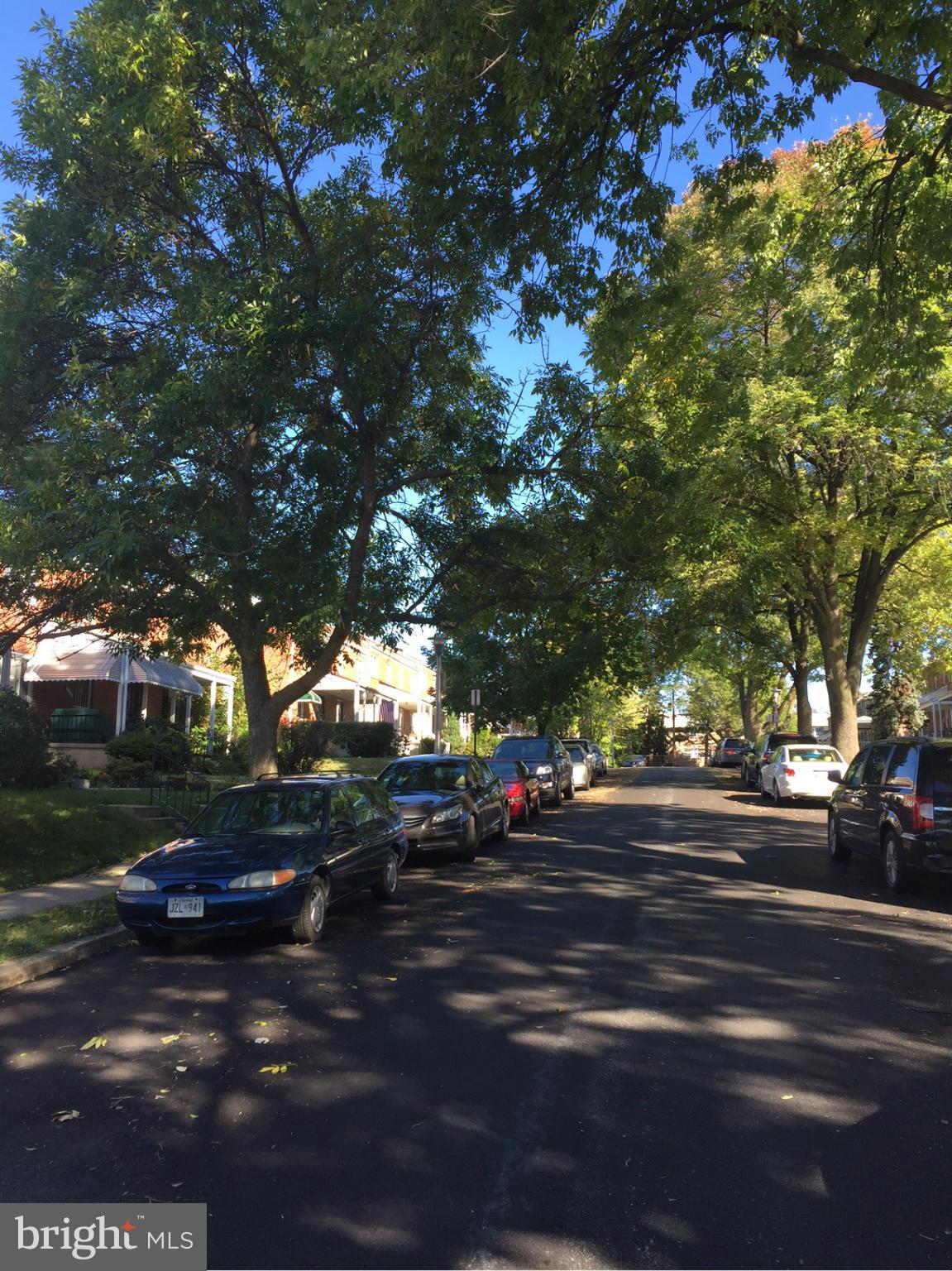 5626 Sagra Road Baltimore, MD 21239 - Photo 24 of 27 a city view with lot of trees and cars parked on road