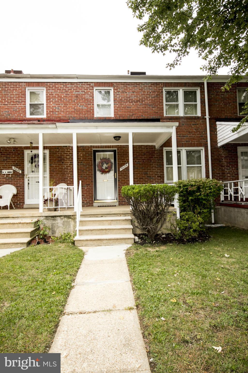 5626 Sagra Road Baltimore, MD 21239 - Photo 27 of 27 a front view of a house with garden